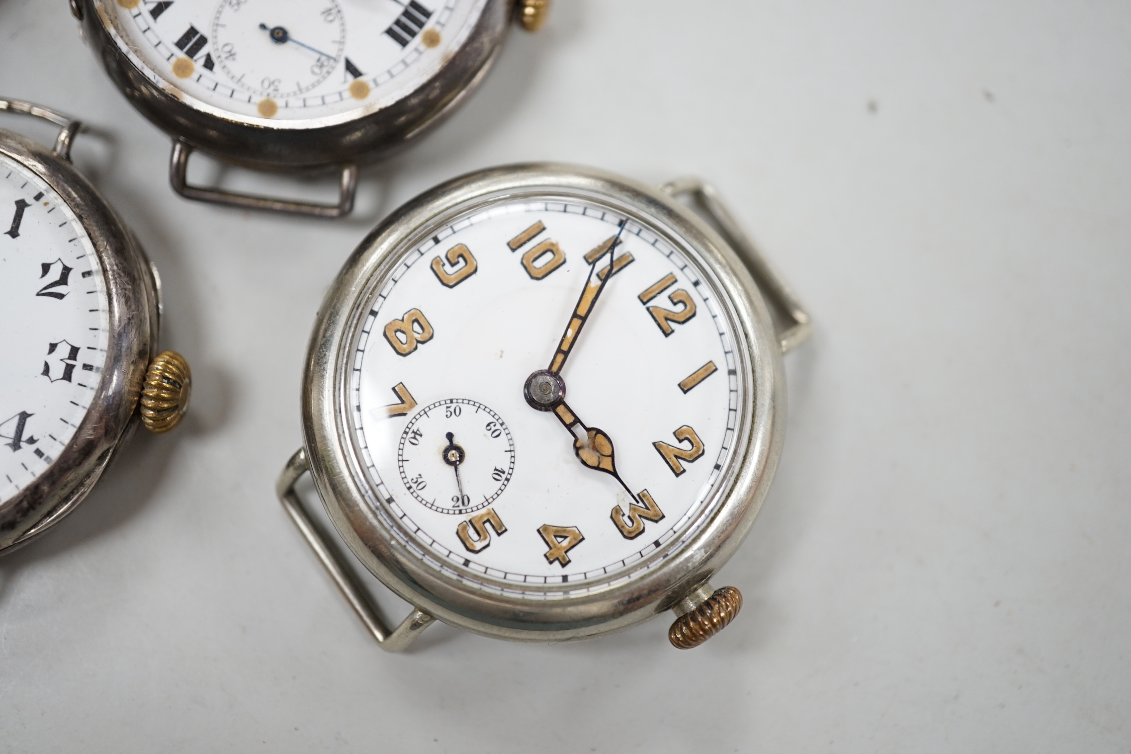 Five assorted early to mid 20th century manual wind wrist watches, including four silver.